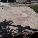 Before photo showing a yard area with loose soil in Gridley CA prior to paver patio installation by Cruzin Landscape